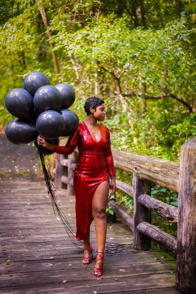 Portrait of a beautiful woman with black balloons by Rawle-C-Jackman Portrait Photography in NJ, NYC and the TriState Area