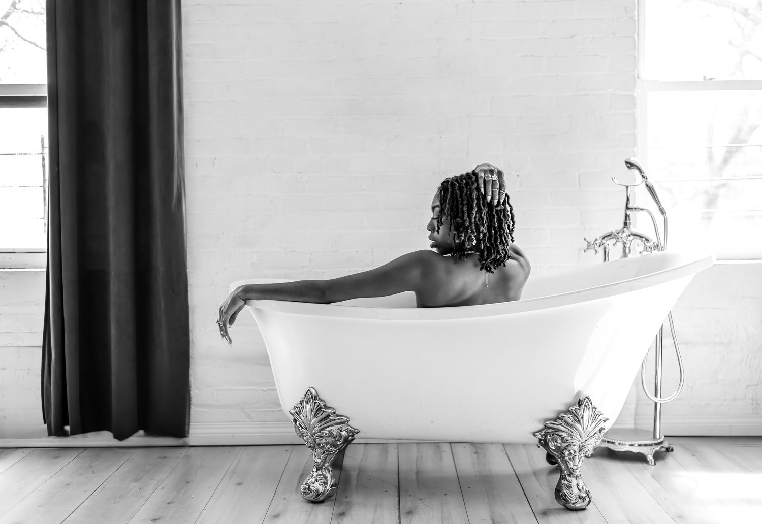 boudior portait of a woman sitting in a bathtub